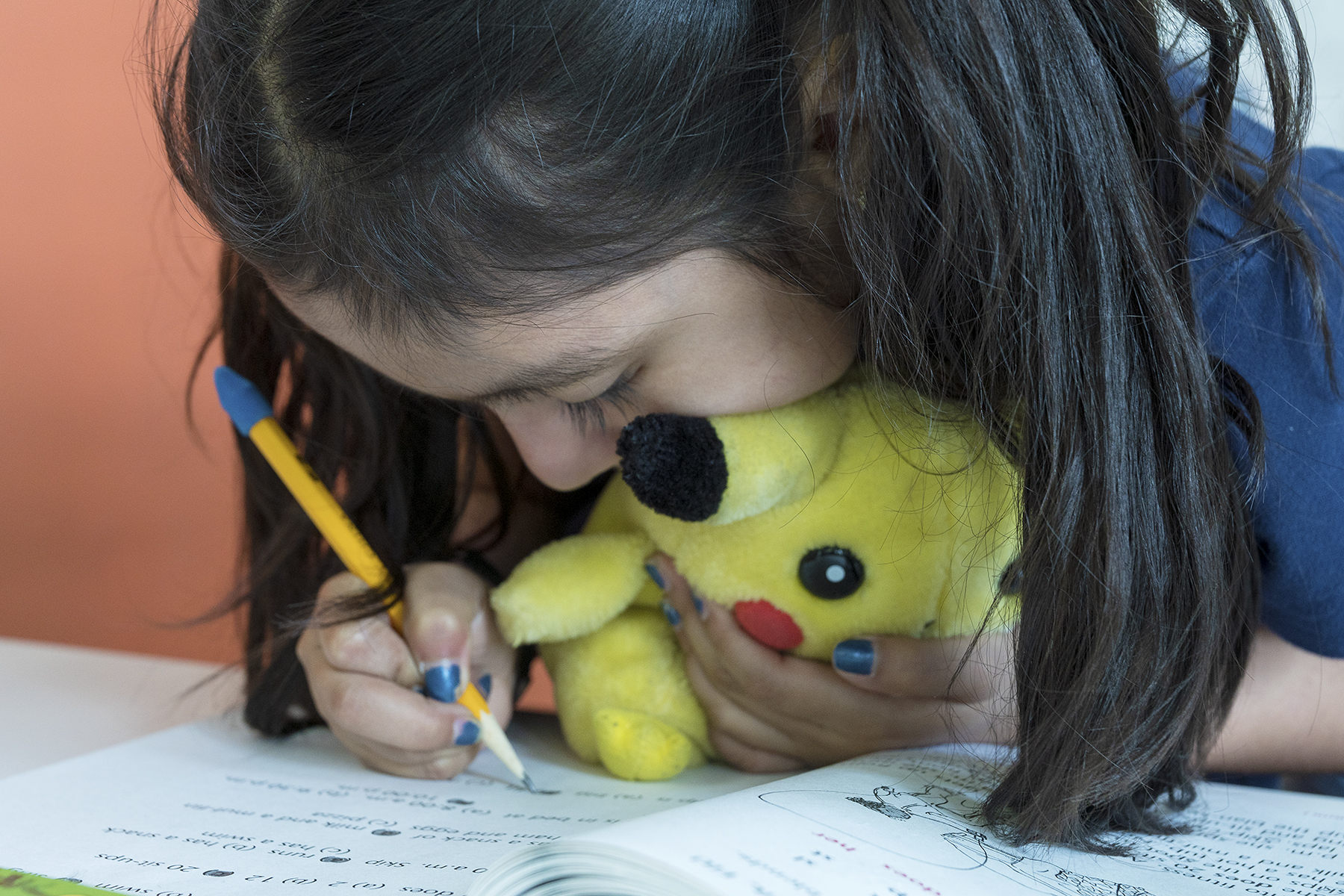 A student works in her workbook.